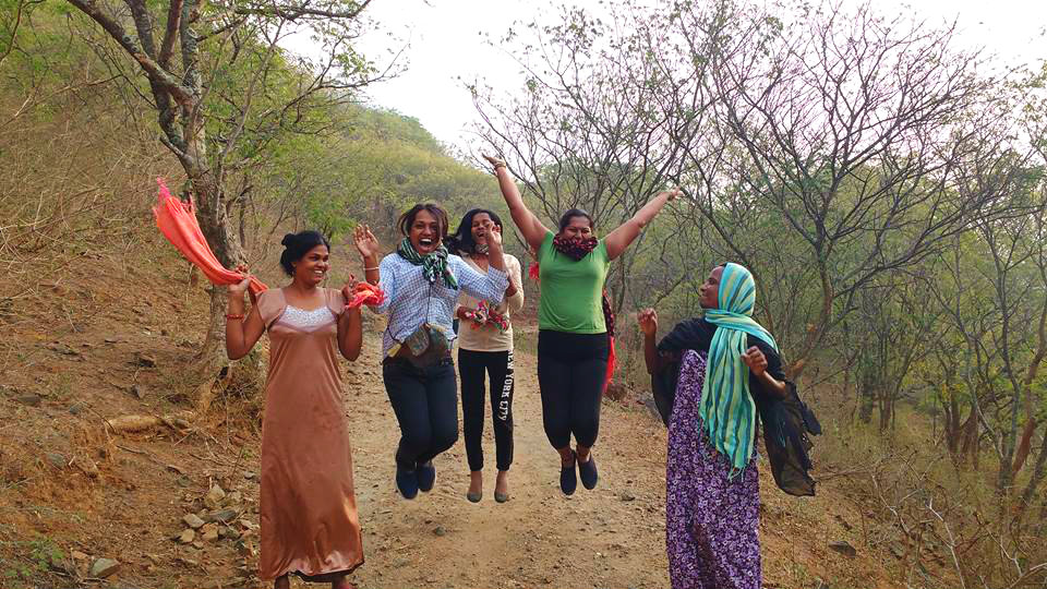 Sahodari girls jumping in joy during a morning walk in Anaikatti hills